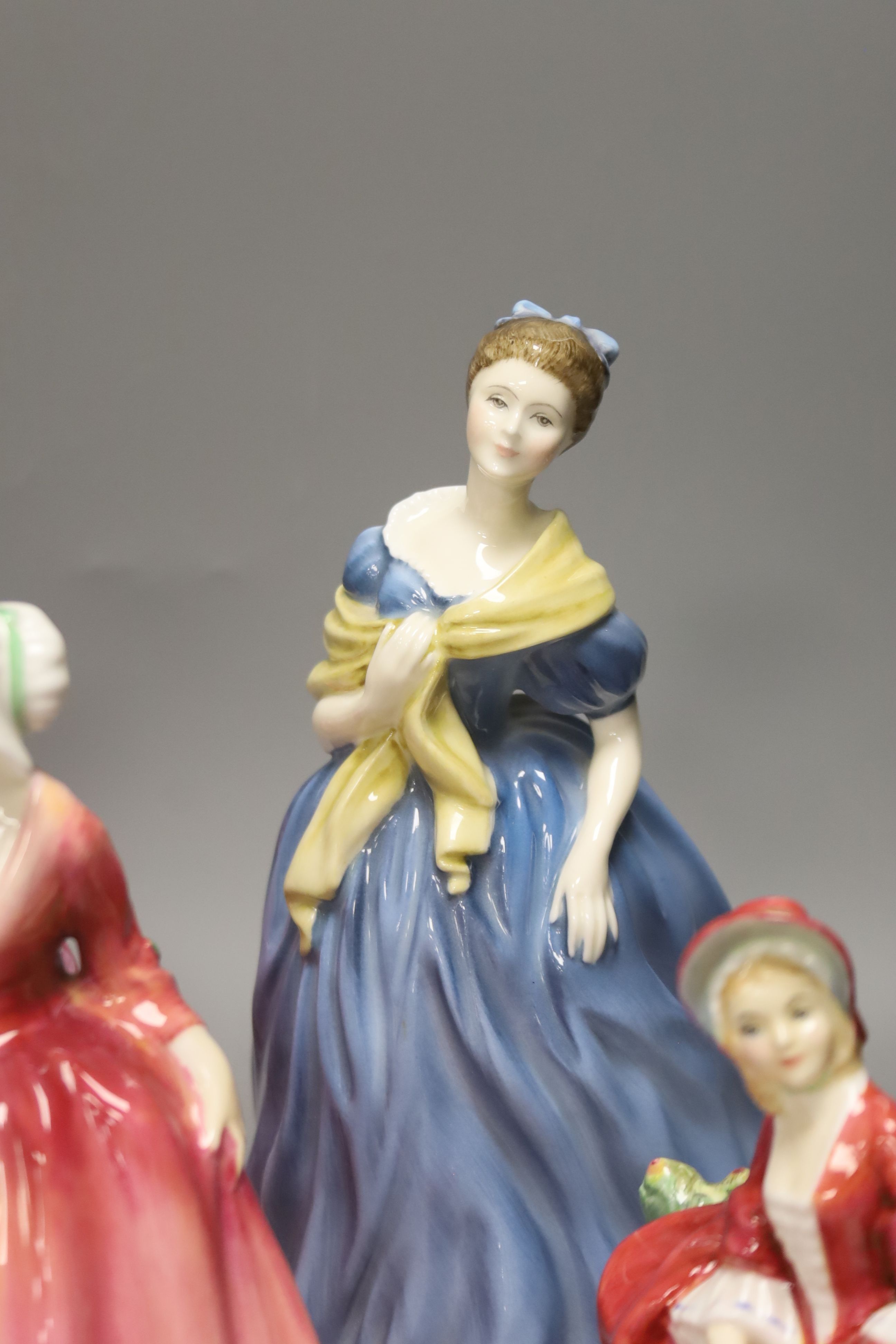 Eight various Royal Doulton figurines, tallest 22cm